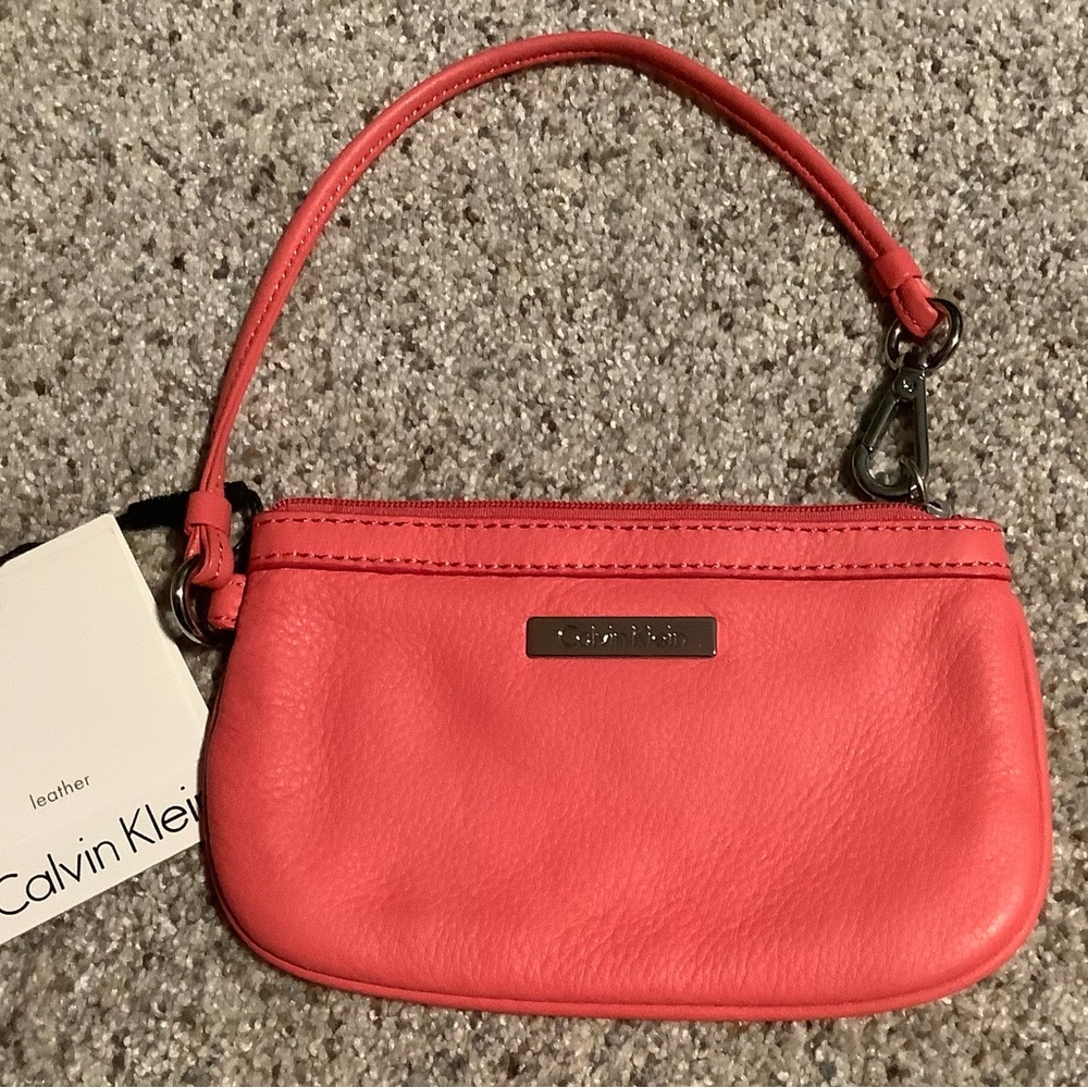 Calvin Klein, Sm. Coral & Silver Leather wristlet. Never been used! NWT